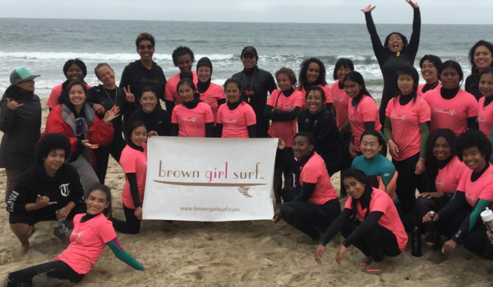 Brown Girl Surf group standing on beach