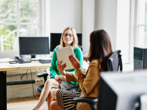 two women in bright office