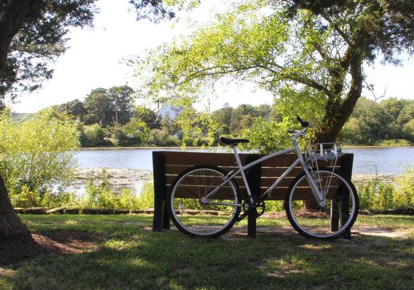 bike leaning on park bench
