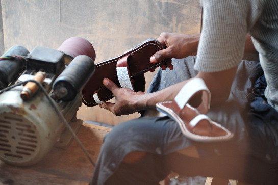 craftsman polishing sandals