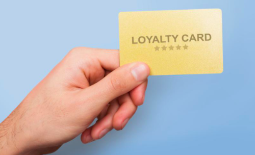 person holding loyalty card