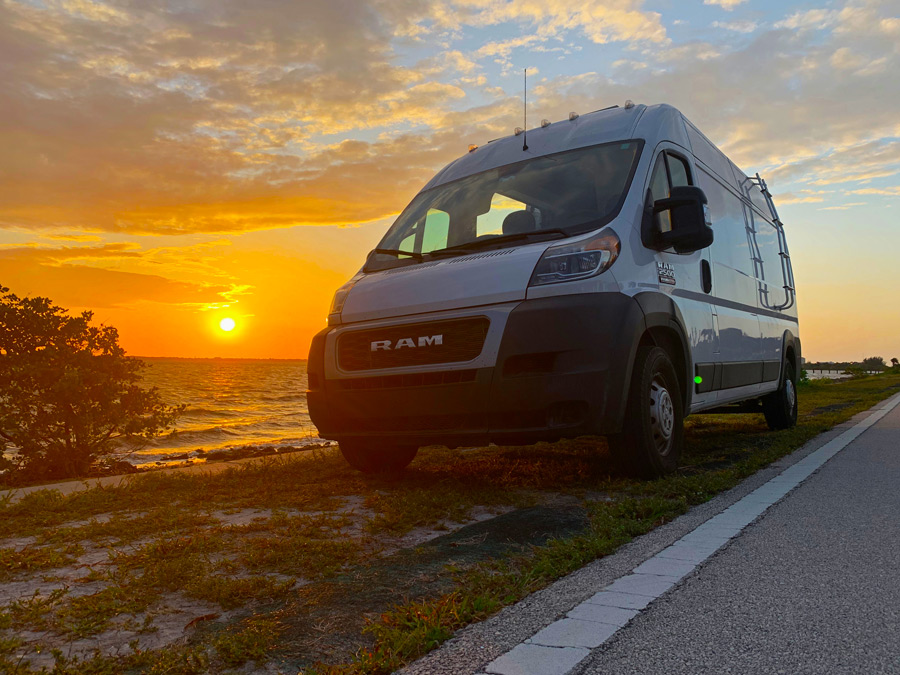 renovated van parked on beach