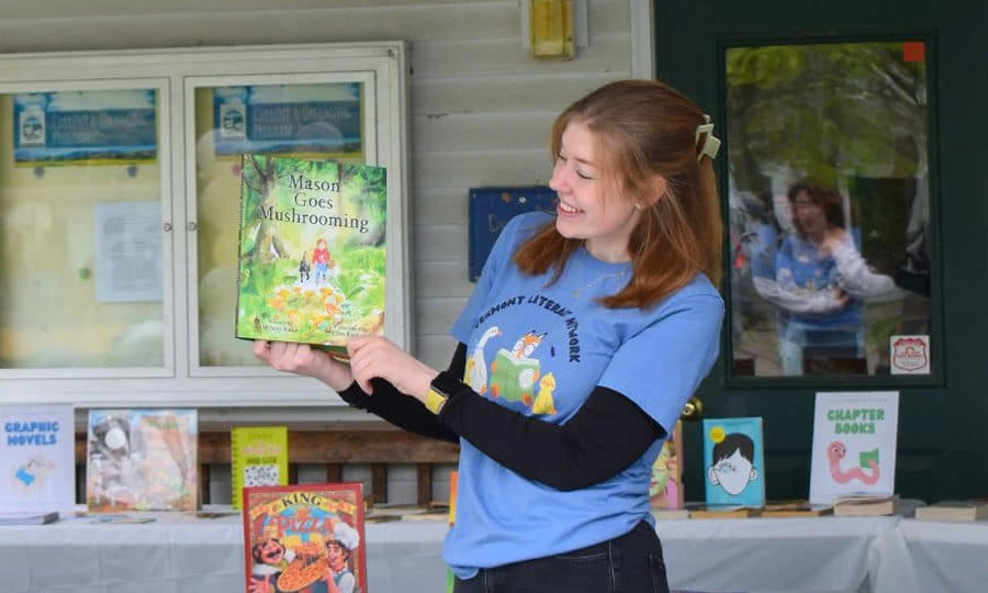 Kayden showing a children's book