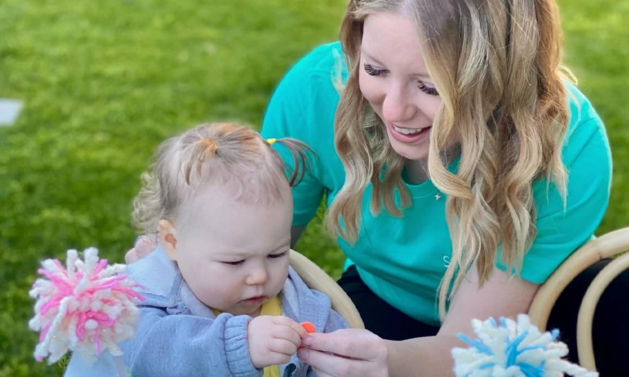 Dr. Rebecca playing with toddler